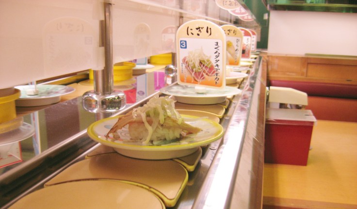 tuna sushi on the conveyer belt