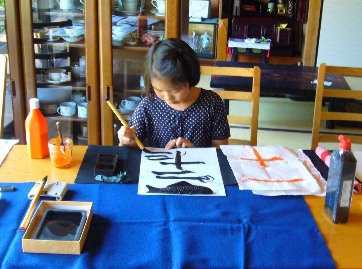japanese calligraphy student practicing the basics